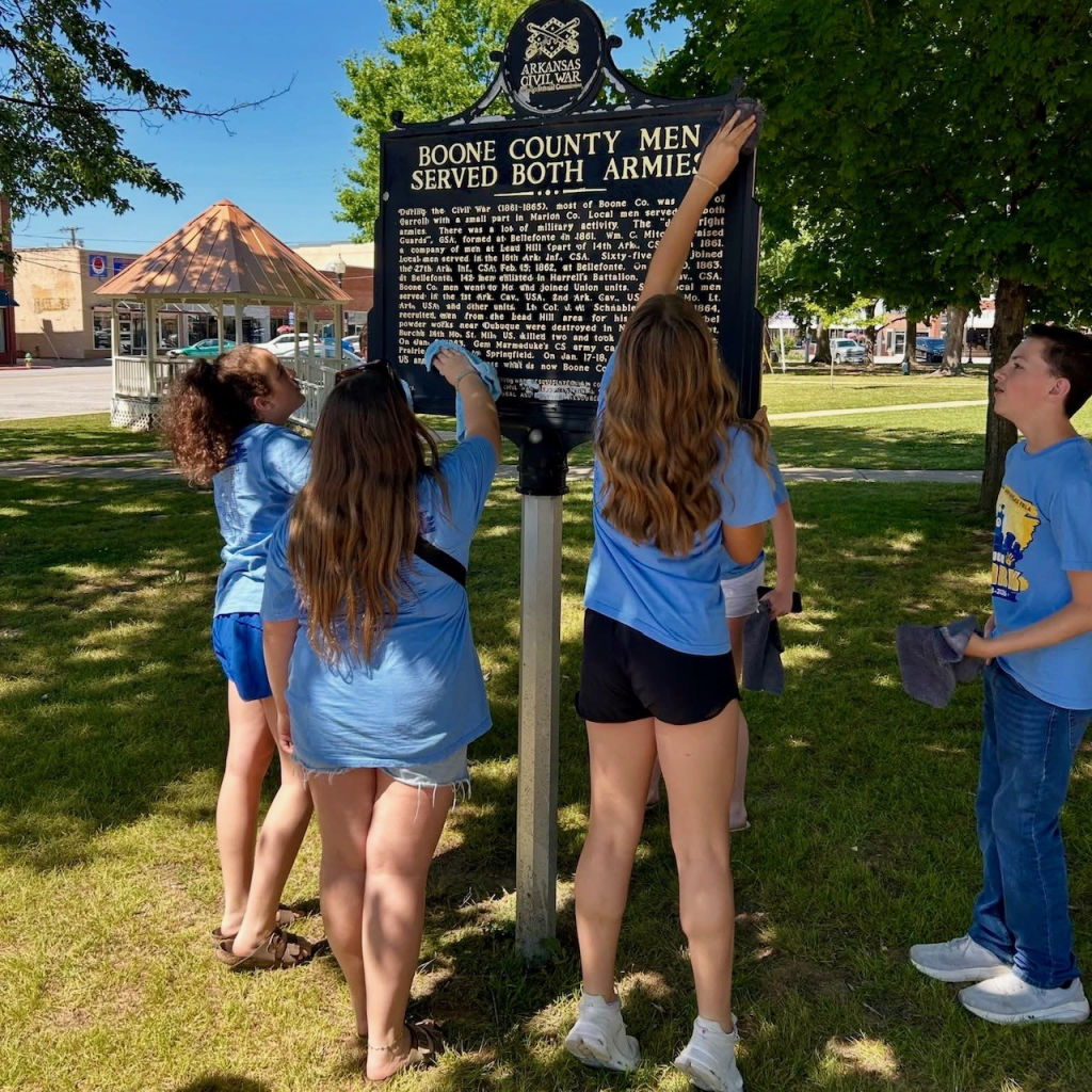 Students clean historic monuments