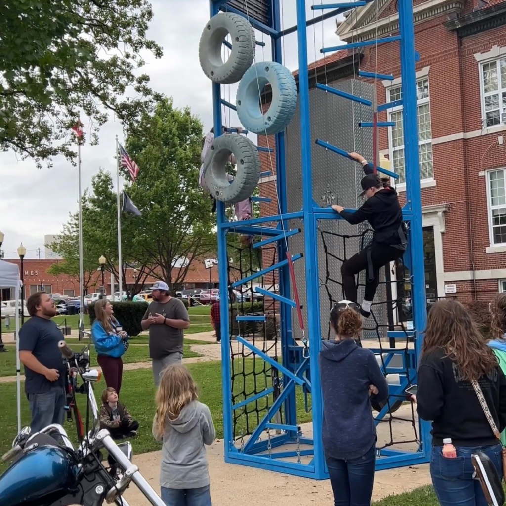 Children on climbing wall at Rev Up Main Street car show