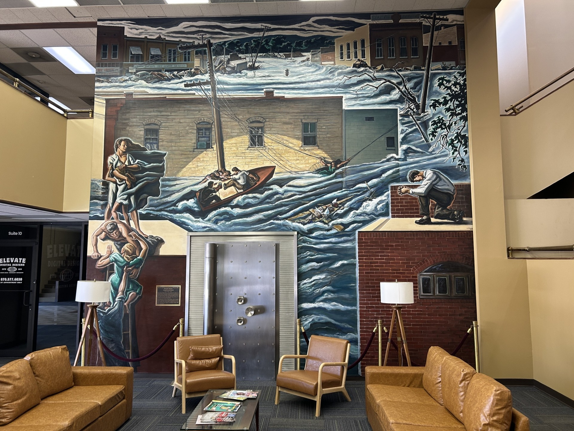 Louis Freund’s colorful mural depicting Harrison’s 1961 flood, painted around the original bank vault inside Rush Plaza at 200 E. Rush Avenue.
